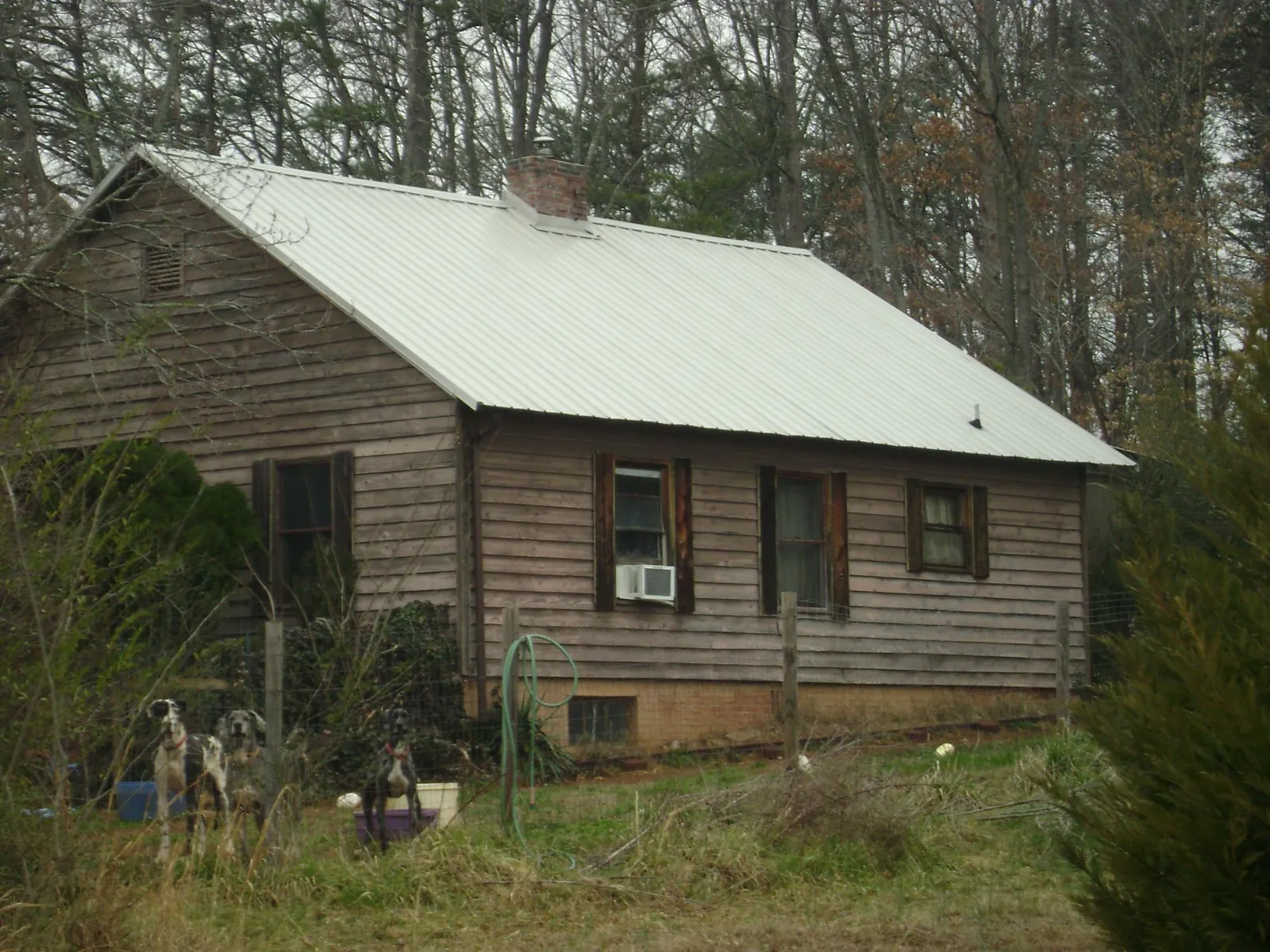 White metal roof on an old wood sided farmhouse, from a Metal Roof Installation job in Rock Tavern